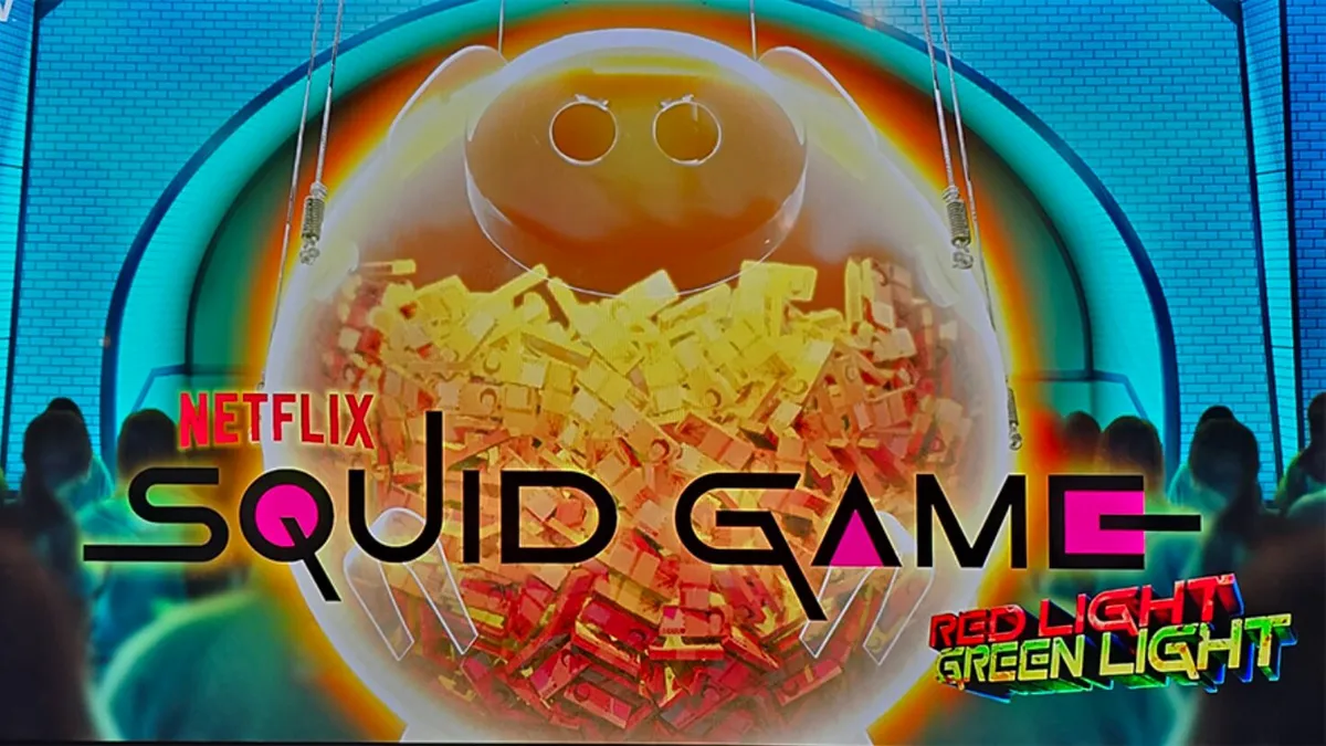 Tampilan visual slot Squid Game: Red Light, Green Light dengan elemen ikonik dari serial tersebut.